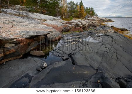 Rocky coast on White sea in autumn on Kola peninsula Russia