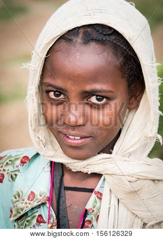 AXUM ETHIOPIA - JUNE 30 2016: Portrait of a young Ethiopian girl - souvenir seller in Axum.