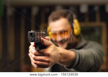 Sport shooting range. The man at the shooting range.