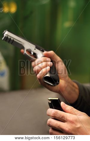 Science use of firearms. Shooting a gun at a shooting range.