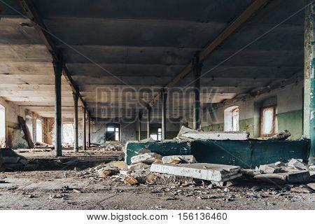 Industrial building interior of abandoned warehouse in dark colors