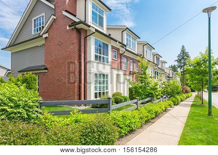 Row of townhouses on a sunny day