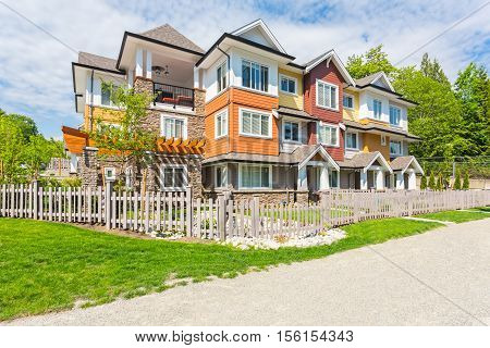 Custom built house in the nice neighbourhood on a sunny day.