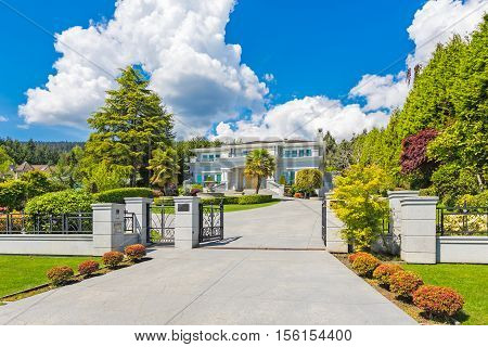 Custom built house in the nice neighbourhood on a sunny day.