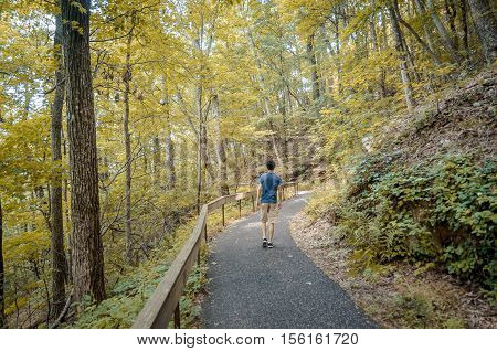 Teenager hiking the Appalachian trail during fall season