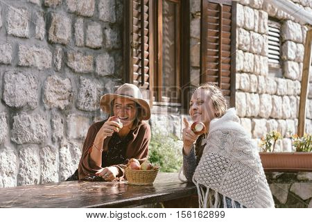 Two Contryside Friends Eating Apple And Smile