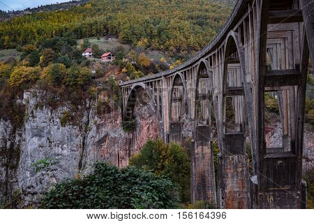 Durdevica Tara arc bridge in the autumn mountains Montenegro.