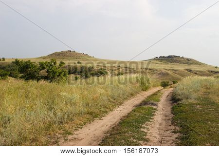 Nature Monument -Kamyshinskye Mountain Ears. The road in the desert in the summer. Volgograd region Russia