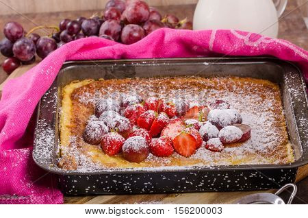 Pancake Cooking In A Plate With Fruit
