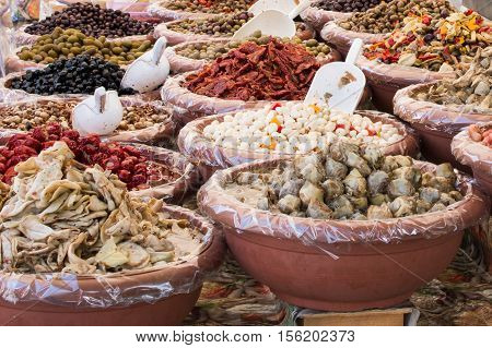 close up of colorful food in pottery