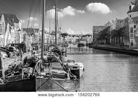 ships in the Thorbeckegracht in Zwolle taken from the Pelserbrugje in black and white