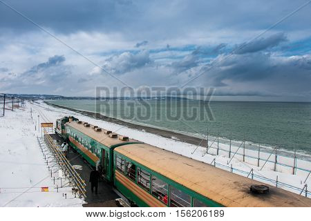 Ryuho Norokko Train Stop At Station Along Beach