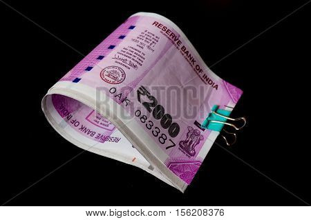 The new rupee 2000 currency notes introduced in india to curb black money. Isolated on black