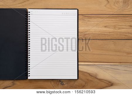 Open Notebook On A Wooden Table Backbround With Copy Space.