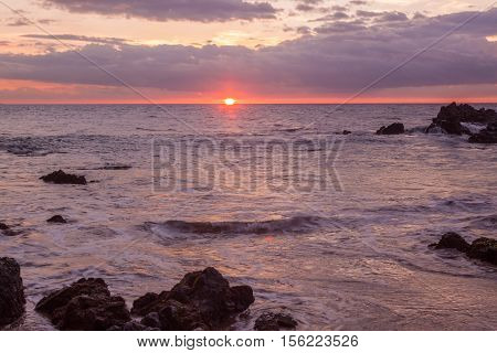 a beautiful sunset along g the Maui Hawaii coast