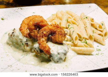 Shrimp breaded with macaroni. White cream and pasta