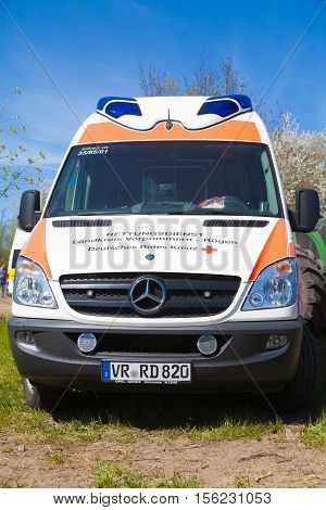 GRIMMEN / GERMANY - MAY 5 2016: german ambulance vehicle stands on tractor show in grimmen / germany at may 5 2016.