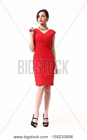 woman with updo hair style in fokrmal party red decolette dress high heels shoes full length body portrait standing isolated on white