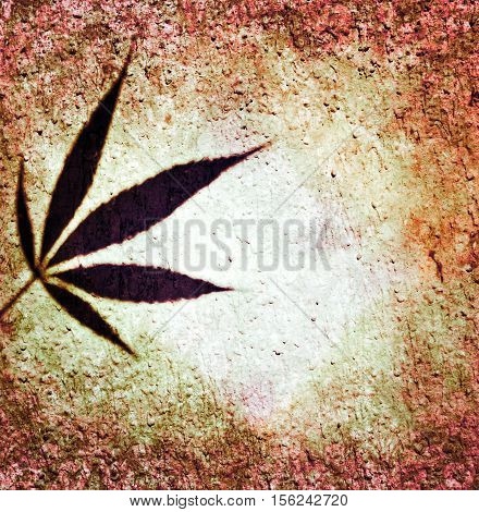Ganja leaf grunge brown orange red wall background
