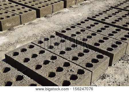 Cinder Blocks Lie On The Ground And Dried. On Cinder Block Production Plant.