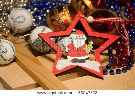 Christmas decorations are in a wooden box.