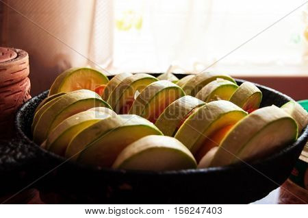 The chopped vegetables are in the pan for baking.