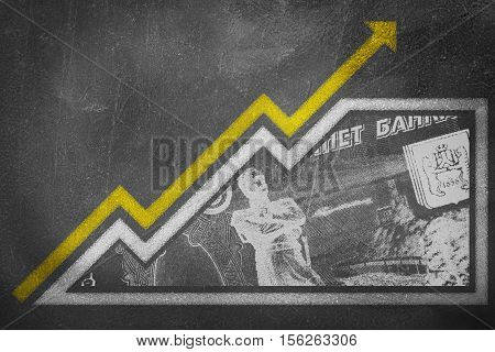 Money Growth Graph On A Chalk Board