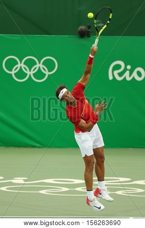 RIO DE JANEIRO, BRAZIL - AUGUST 7, 2016: Olympic champion Rafael Nadal of Spain in action during men's singles first round match of the Rio 2016 Olympic Games at the Olympic Tennis Centre