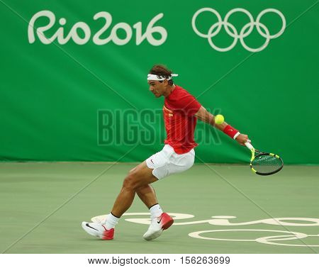 RIO DE JANEIRO, BRAZIL - AUGUST 7, 2016: Olympic champion Rafael Nadal of Spain in action during men's singles first round match of the Rio 2016 Olympic Games at the Olympic Tennis Centre