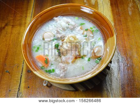boiled rice with pork sausage topping egg on bowl