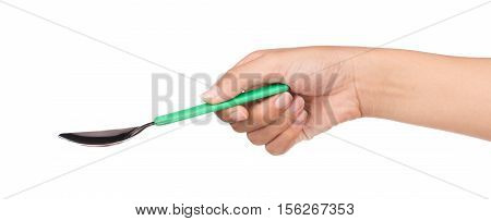 hand holding green spoon isolated on white background