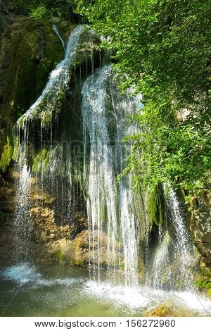 waterfall on a mountain river in the forest