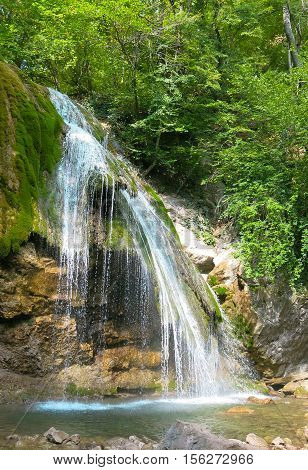 waterfall on a mountain river in the forest