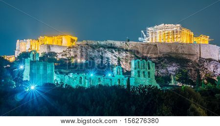 Parthenon and Herodium construction in Acropolis Hill in Athens, Greece shot in blue hour