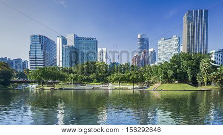cityscape and trees garden park at the business town in the morning
