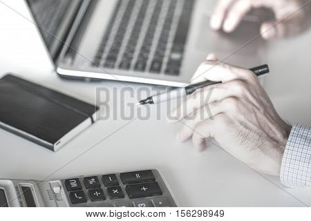 Closeup of a male hands busy typing on a laptop