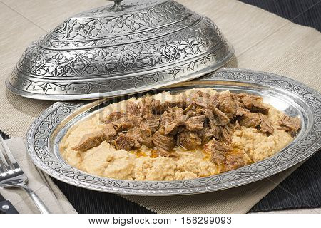 Traditional Turkish food called Hunkar Begendi, lamb stew served on mashed eggplant.