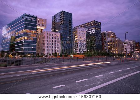 moving car with blur light through Dronning Eufemias gate street in Oslo at night
