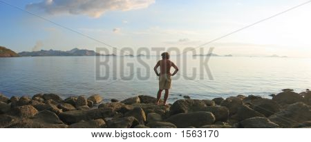 A Man Looking Over The Infinite Tropical Sea And Island Archipelago, Labuan Bajo, Pede Beach, Flores