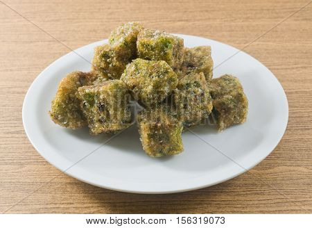 Plate of Fried Chinese Pancake or Fried Steamed Dumpling Made of Garlic Chives Rice Flour and Tapioca Flour. Traditional Food of China.