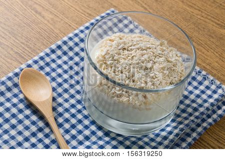 Cup of Homemade Yoghurt Topping with Porridge Oats Nutritionally Rich in Protein Calcium Riboflavin Vitamin B6 and Vitamin B12.