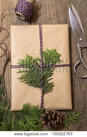 Wrapping Christmas presents with the cypress branches
