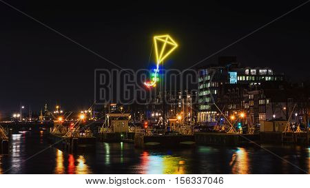 Amsterdam Netherlands - December 18 2015: Light Festival Amsterdam neon light kite above the port of Amsterdam
