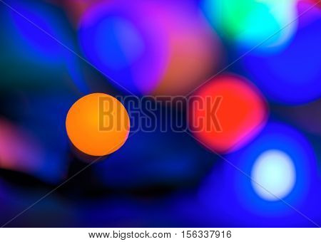 Abstract vibrant bright round bokeh over dark background
