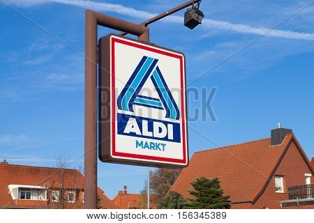 BURG / GERMANY - NOVEMBER 13 2016: Aldi sign against blue sky. Aldi is a leading global discount supermarket chain with almost 10000 stores in 18 countries.