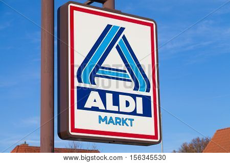 BURG / GERMANY - NOVEMBER 13 2016: Aldi sign against blue sky. Aldi is a leading global discount supermarket chain with almost 10000 stores in 18 countries.