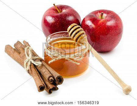 honey pot cinnamon and red apple on an isolated white background, rope
