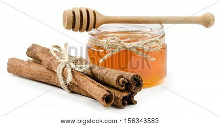honey pot cinnamon on an isolated white background, rope