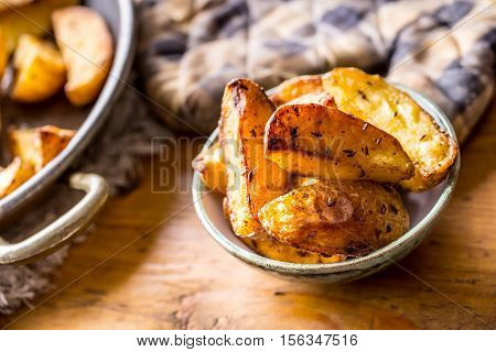 Potato. Roasted potatoes. American potatoes with salt pepper and cumin. Roasted potato wedges delicious crispy.
