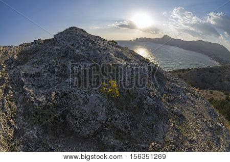 Late afternoon sun over the horizon. The top Alchak cape Crimea September.